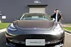 An employee explains the Tesla Model 3 vehicle at the company's Shanghai Gigafactory in Shanghai, China. [REUTERS]