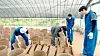 Yoo Jae-suk, Kim Yeon-koung and Lee Kwang-soo make traditional Korean tiles in 'Korea No. 1.' [NETFLIX]