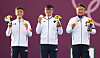 From left, Kim Je-deok, Kim Woo-jin and Oh Jin-hyek hold up their archery men's team gold medals on the podium on Monday at Yumenoshima Park Archery Field in Tokyo. [YONHAP]