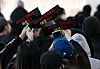 Students take photos with signs that read Sungshin Women's University's identity is women during a protest on Friday. [NEWS1]