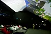 People are lying down in the Vertical Cinema zone of the Korea Pavilion, which has a mega-sized screen and allows people to watch videos. [KOREA TRADE-INVESTMENT PROMOTION AGENCY]