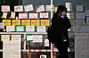 A student walks past a building at Sungshin Women's University, with walls covered with hand-written posters and signs condemning the school's decision to admit male students to the International School of Korean Culture and Technology. [NEWS1]