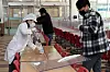 School staffers remove partitions installed at a cafeteria of Sanjeong Middle School in in the southwestern city of Gwangju ahead of the new academic year on Feb. 27. [YONHAP]