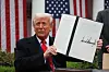 U.S. President Donald Trump holds a signed executive order on tariffs in the White House Rose Garden in Washington on April 2. [REUTERS/YONHAP]