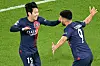Paris Saint-Germain's Lee Kang-in, left, celebrates with Goncalo Ramos after scoring their third goal during a UEFA Champions League match against AC Milan at the Parc de Princes in Paris on Wednesday. [AFP/YONHAP]