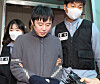 Jeon Joo-hwan, stalker and murderer, who killed his co-worker on Sept. 14 last year, being escorted to the prosecutors' office by the police on Sept. 21 2022. [JOINT PRESS CORPS]