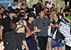 Fans try to take a photo of Lee Kang-in, center, as he arrives at Gimhae International Airport in Busan with his Paris Saint-Germain teammates on Wednesday ahead of a Coupang Play Series preseason friendly against K League club Jeonbuk Hyundai Motors on Thursday. [NEWS1]