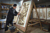 Kim Yeong-jo, who is designated as a national intangible cultural asset due to his knowledge on the techniques of creating nakhwa paintings, which uses a heated iron instead of a brush, works at his studio in Boeun, North Chungcheong. [PARK SANG-MOON]