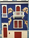 The original red, white and blue two-story building painted with four hands holding tubes of red lipstick of the Toiletpaper headquarters in Milan [SHIN MIN-HEE]