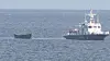 A wooden boat that four North Korean traveled on to defect to South Korea on Oct. 24 being towed. [YONHAP]