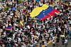 People carry Venezuela's national flag to protest the election results that awarded Venezuela's President Nicolás Maduro with a third term, in Maracaibo, Venezuela July 30, 2024. [REUTERS]
