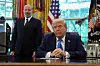 U.S. President Donald Trump looks on, with U.S. Secretary of Commerce Howard Lutnick standing by his side, in the Oval Office at the White House in Washington, D.C., U.S., on Sept.19. [REUTERS/YONHAP]