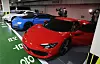 Luxury vehicles allegedly bought with proceeds from an illegal gambling website are lined up in an underground parking garage after being confiscated by prosecutors in Busan on Monday. [SONG BONG-GEUN]