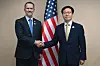 This photo, released by Korea's Industry Ministry, shows Trade Minister Yeo Han-koo, right, shaking hands with U.S. Trade Representative Jamieson Greer in Malaysia as the two meet to attend a meeting of economic ministers of the Association of Southeast Asian Nations (Asean). [MINISTRY OF TRADE, INDUSTRY AND ENERGY]