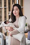 Actor Uhm Ji-won as Hyun-jin, a workaholic executive-turned-first-time mother taking care of her baby at a postnatal care center in tvN drama series ″Birthcare Center.″ [TVN]