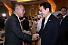 Hyundai Motor Group Executive Chair Euisun Chung, left, shakes hands with President Lee Jae Myung at a business event in Abu Dhabi on Nov. 19. [YONHAP]