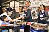 CEO of Homeplus Lee Jae-hoon, right, and Jim Pillen, governor of the U.S. state of Nebraska, grill and serve 1855 Black Angus beef from the United States at the Homeplus Mega Food Market in Gangseo District, western Seoul, on Thursday afternoon. Pillen's visit is in recognition of the hypermarket chain's handling of U.S. beef in large quantities and its exclusive retailing of 1855 Black Angus brand beef produced in Nebraska. [HOMEPLUS]