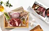 A steak meal kit sold by Fresh Easy. The kit includes a cut of beef, asparagus, garlic, red onions, steak sauce, olive oil and herb salt. [FRESH EASY]