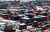 Cargo containers are stacked at a port in Busan on June 1. [YONHAP]
