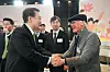President Yoon Suk Yeol, left, shakes hands with an elderly during a public livelihood debate held at the headquarters of the Health Insurance Review & Assessment Service in Wonju, Gangwon, Thursday. [PRESIDENTIAL OFFICE]