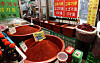 Red pepper powder, dried pepper and gochujang (hot pepper paste) are on sale in Gwangjang Market in Jongno District, central Seoul on Wednesday. According to the Korea Agro‑Fisheries & Food Trade Corporation, the price of 1 kilogram (2.2 pounds) of red pepper powder was 37,583 won ($33.70), up 44 percent from a year earlier. [YONHAP]