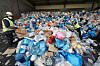 Workers sort recyclable waste at a sorting facility in Dobong District, northern Seoul, on Jan. 26. The Seoul Metropolitan Government has launched a campaign to encourage residents to reduce household waste by 10 liters (2.6 gallons) per person over the next two years, or one trash bag annually. If all 10 million residents participate, the city estimates the effort will reduce waste by about 60 tons per day, and about 44,000 tons of household waste over two years in preparation for a nationwide ban on dumping garbage in landfills. [NEWS1]