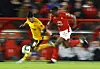 Wolverhampton Wanderers' Hwang Hee-chan in action with Nottingham Forest's Willy Boly during a Carabao Cup quarterfinal at City Ground in Nottingham on Wednesday. [REUTERS/YONHAP]