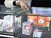 A visitor examines the differences between genuine and counterfeit toys and clothing at the 2025 Trademark-Design Right Exhibition at Coex in Gangnam District, southern Seoul, on Dec. 3. Running until Dec. 6, the expo highlights the importance of trademarks and design in today’s world. [YONHAP]