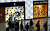Travelers walk around the duty-free area at Incheon International Airport in Incheon, west of Seoul, on Feb. 14. [NEWS1]