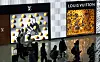 Travelers walk around the duty-free area at Incheon International Airport in Incheon, west of Seoul, on Feb. 14. [NEWS1]