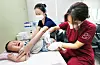 A baby receives a flu shot at a hospital in Daegu on Wednesday. The vaccination program for children aged 6 months through 13 started across the nation on the same day. [NEWS1]