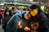 Residents in Pittsburgh console each other during a candlelight vigil on Sunday. [AP/YONHAP]