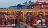 Containers are stacked at the Busan New Port early this month. [YONHAP]