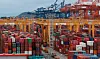 Containers are stacked at the Busan New Port early this month. [YONHAP]