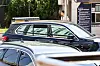 A vehicle presumed to be carrying Kim Ho-joong leaves the police station on Tuesday. [JOONGANG ILBO]