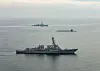 The nuclear-capable USS Kentucky ballistic missile submarine sails between two warships as it arrives in Busan on Tuesday afternoon. [UNITED STATES FORCES KOREA]