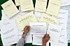 A National Assembly employee goes through details of the third supplementary budget at the National Assembly in Seoul on June 4. [JOINT PRESS CORPS]