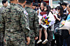 Korean nationals who were evacuated from Sudan safely arrive at Seoul Air Base in Seongnam, Gyeonggi, on Tuesday afternoon. [NEWS1]