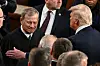 U.S. President Donald Trump, right, greets US Supreme Court Chief Justice John Roberts as Trump to address to a joint session of Congress in the House Chamber of the US Capitol in Washington, DC, on March 4. [AFP/YONHAP]