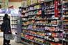 A customer stands in the chocolate aisle at a retail store in Seoul on Tuesday. Valentine’s Day has passed, and the price of chocolate is expected to rise as the price of cacao in the global market has reached its highest since November 2020 due to severe drought in West Africa including Cote d’lvoire, where cacao is produced. [YONHAP]