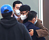 Son Heung-min, right, embraces his father Son Woong-jung at Incheon International Airport on Tuesday morning before jetting off to London to rejoin his Premier League club Tottenham Hotspur. [YONHAP]