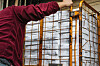 A post office worker in Seoul pushing a cart full of this year's comprehensive real estate holding tax on Monday. [YONHAP]