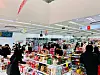Shoppers buy goods at a Daiso store, a low-cost chain. [DAISO]