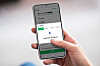 A smartphone screen shows Samsung Pay listed among Naver Pay's payment methods. [SAMSUNG ELECTRONICS]