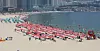 Beachgoers cool themselves off at Haeundae Beach in Busan on Sunday. Beaches are quieter this year as vacationers try to avoid popular places in the midst of the fourth wave of Covid-19 cases. [SONG BONG-GEUN]