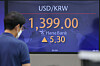 The won depreciating to 1,399 won against the dollar on Friday. [YONHAP]