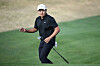 Kevin Yu of Taiwan acknowledges fans after a chip onto the 16th green during the final round of The American Express at Pete Dye Stadium Course in La Quinta, California on Sunday. [GETTY IMAGES]