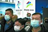 People wear face masks to protect against Covid-19 look at an exhibit at a visitors center at Winter Olympic venues in Yanqing on the outskirts of Beijing. Beijing Olympic organizers showed off the downhill skiing venue and the world’s longest bobsled and luge track last Friday, one year ahead of the opening of the 2022 Winter Games. [AP/YONHAP]