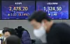 Electronic display boards at Hana Bank in central Seoul show stock and foreign exchange markets on Tuesday morning. [YONHAP]