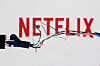 Broken Ethernet cable is seen in front of Netflix logo in this illustration taken March 11, 2022. Netflix and SK Broadband entered into the second phase of the legal battle over the payment of network usage fees. [REUTERS/YONHAP]